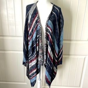 Free People sweater wrap with openings for arms and two pockets.  NWOT, XS